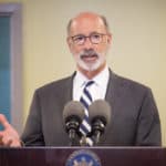 governor speaking at podium