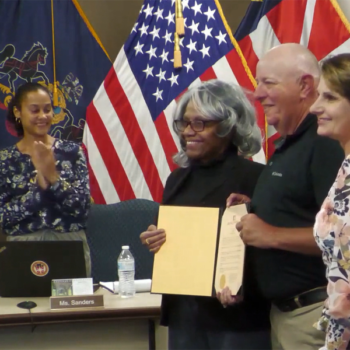Gettysburg Borough Mayor Rita Frealing, left, congratulates retiring Police Sgt. Larry Weikert.
