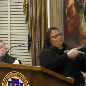 Gettysburg Borough Parking Manager Becka Fissel demonstrates how parking rates are adjusted as Borough Police Chief Robert Glenny looks on.