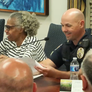 Sgt. Christopher Evans, the department's officer-in-charge, delivers his report during Monday's council meeting. Mayor Rita Frealing is also pictured.