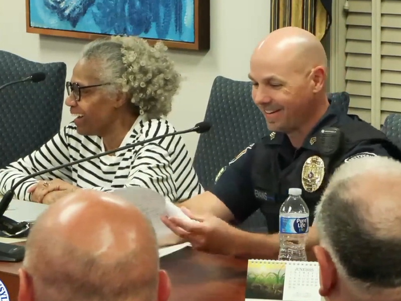 Sgt. Christopher Evans, the department's officer-in-charge, delivers his report during Monday's council meeting. Mayor Rita Frealing is also pictured.
