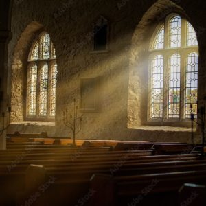 Stained glass windows with sun rays pouring in