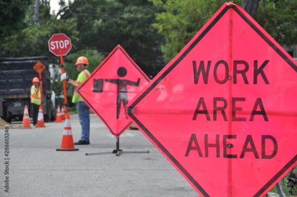 Construction Work Sign, Flaggers and Cones