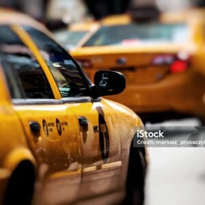 Yellow cab speeds through Times Square in New York, NY, USA.