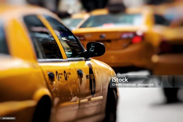 Yellow cab speeds through Times Square in New York, NY, USA.