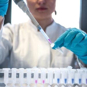 Scientist working with laboratory equipment