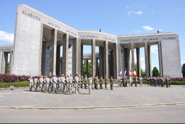 Soldiers assembled in front of the Mardasson Memorial outside Bastogne, Belgium